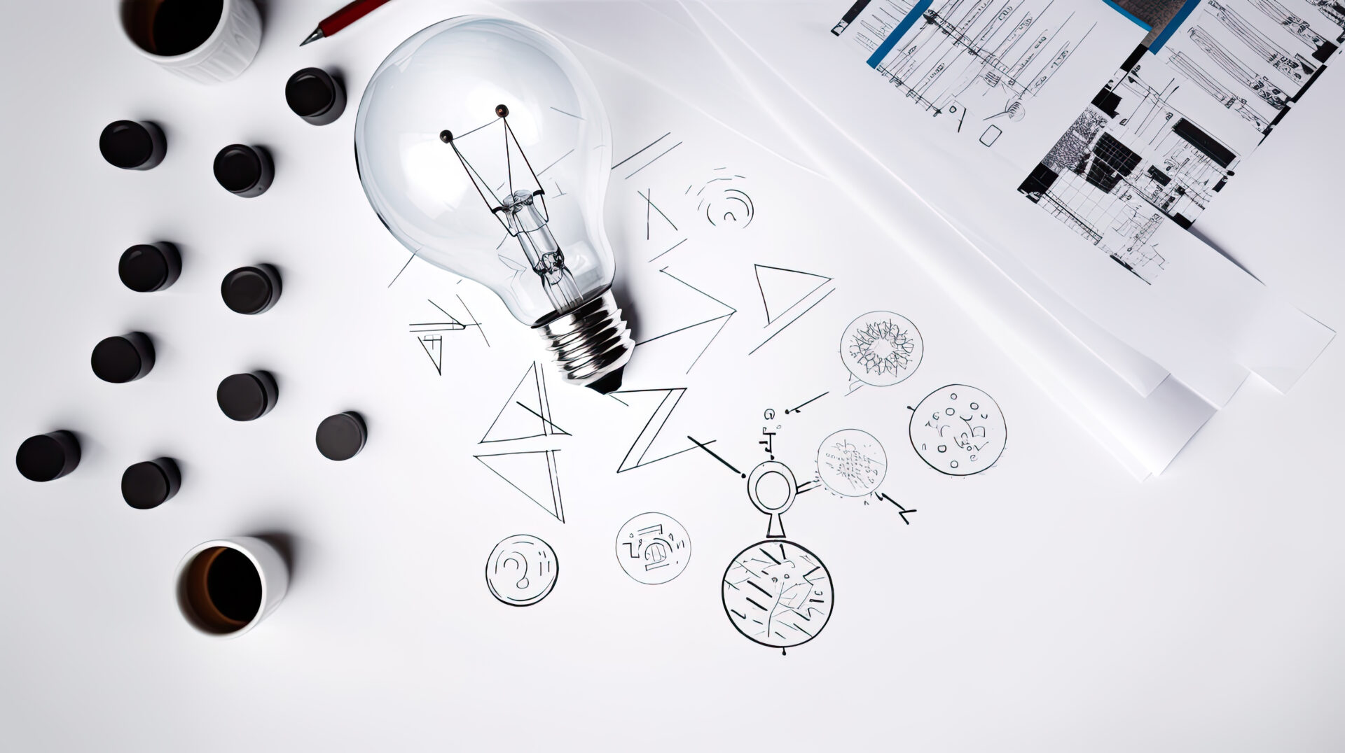 How to Build a Successful MVP on a Tight Budget 2 A whiteboard filled with sketches and notes outlining strategies for defining a Successful MVP on a Tight Budget.